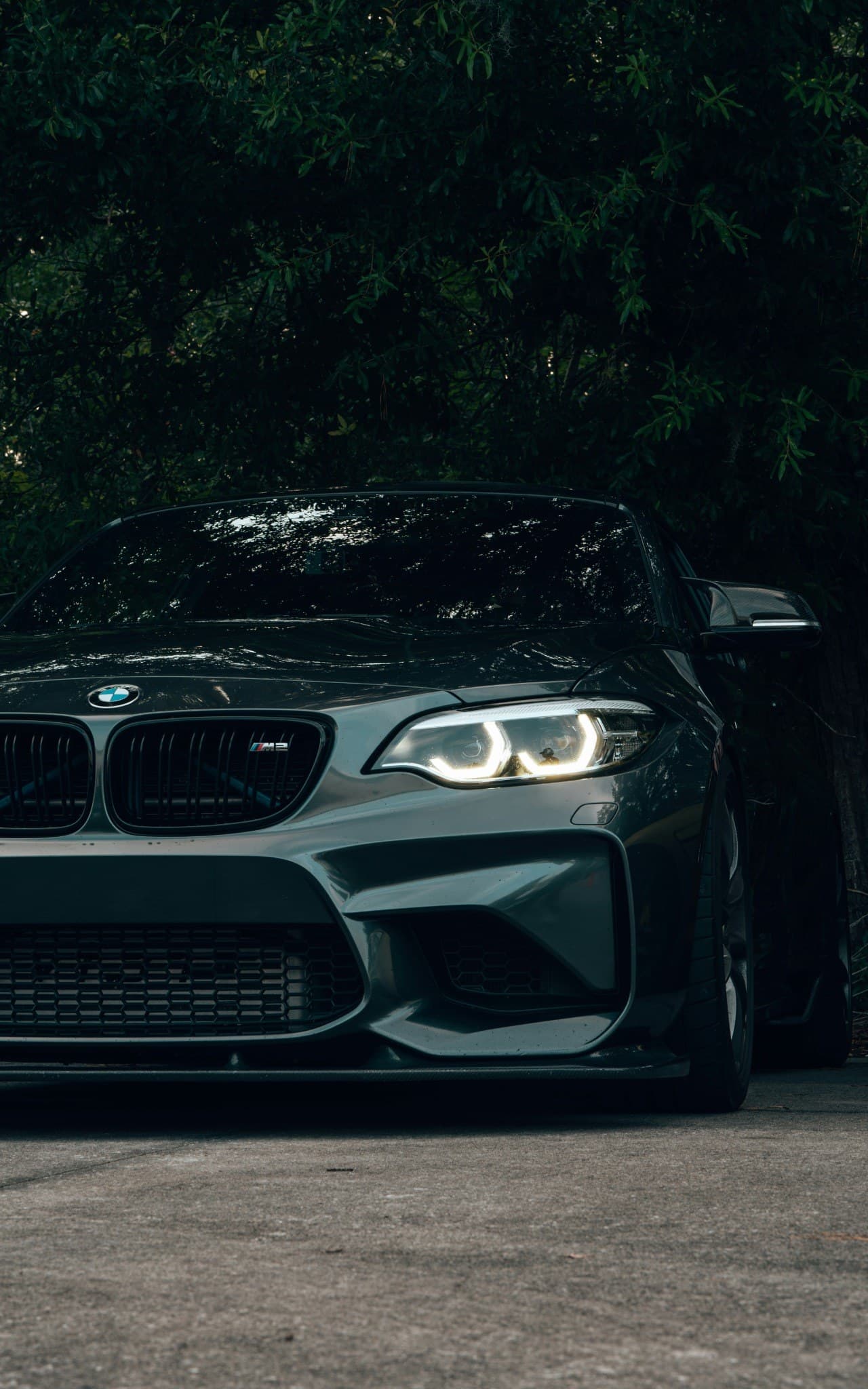 BMW M2 photographed in a dark, premium setting